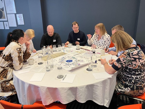 Scottish Government representatives using visual prompts to guide Finnish delegates through their collaborative approaches, and reflect on successes and challenges.